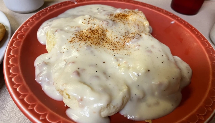 Biscuits with white sausage gravy and paprika, served at JC's Country Diner Restaurant Elwood Utah.