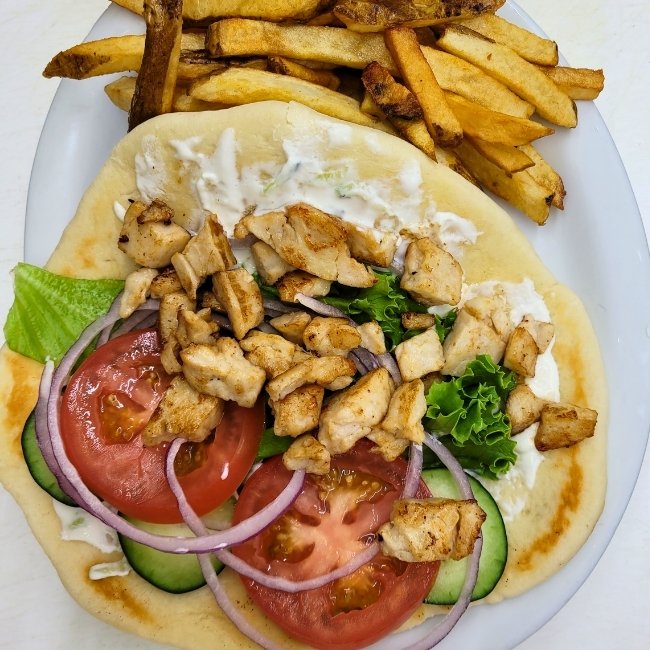 A JC's Country Diner pita wrap with grilled chicken, veggies, and fries in Elwood, Utah.