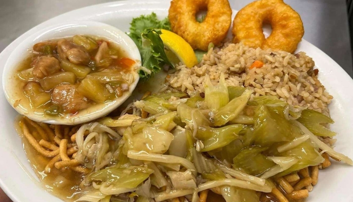 Enjoy JC's Country Diner Restaurant Elwood Utah's plate of fried rice, noodles, donuts, and stew.